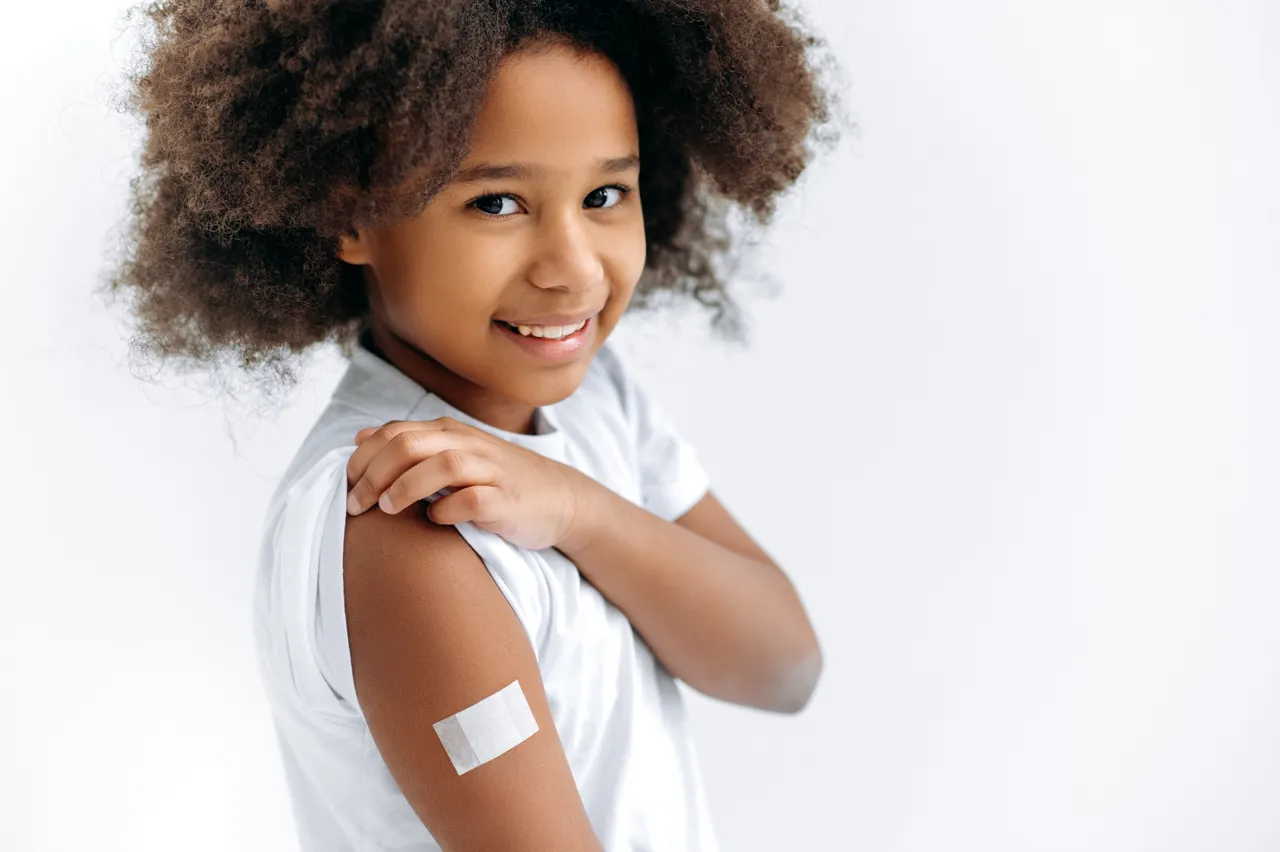 Child receiving vaccination