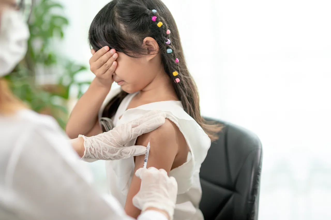 Child getting flu shot