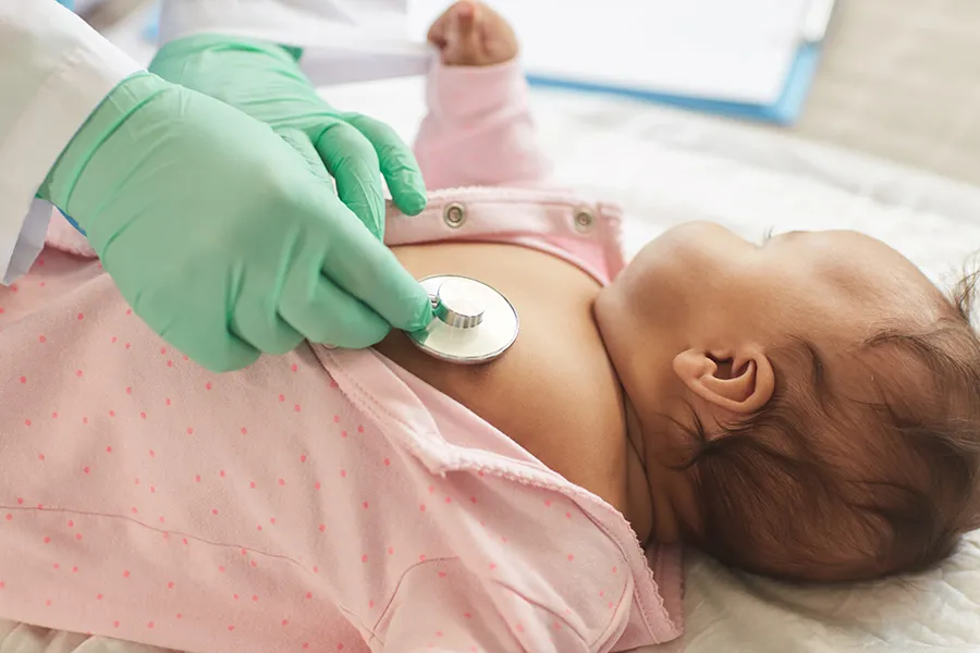 Doctor examining child