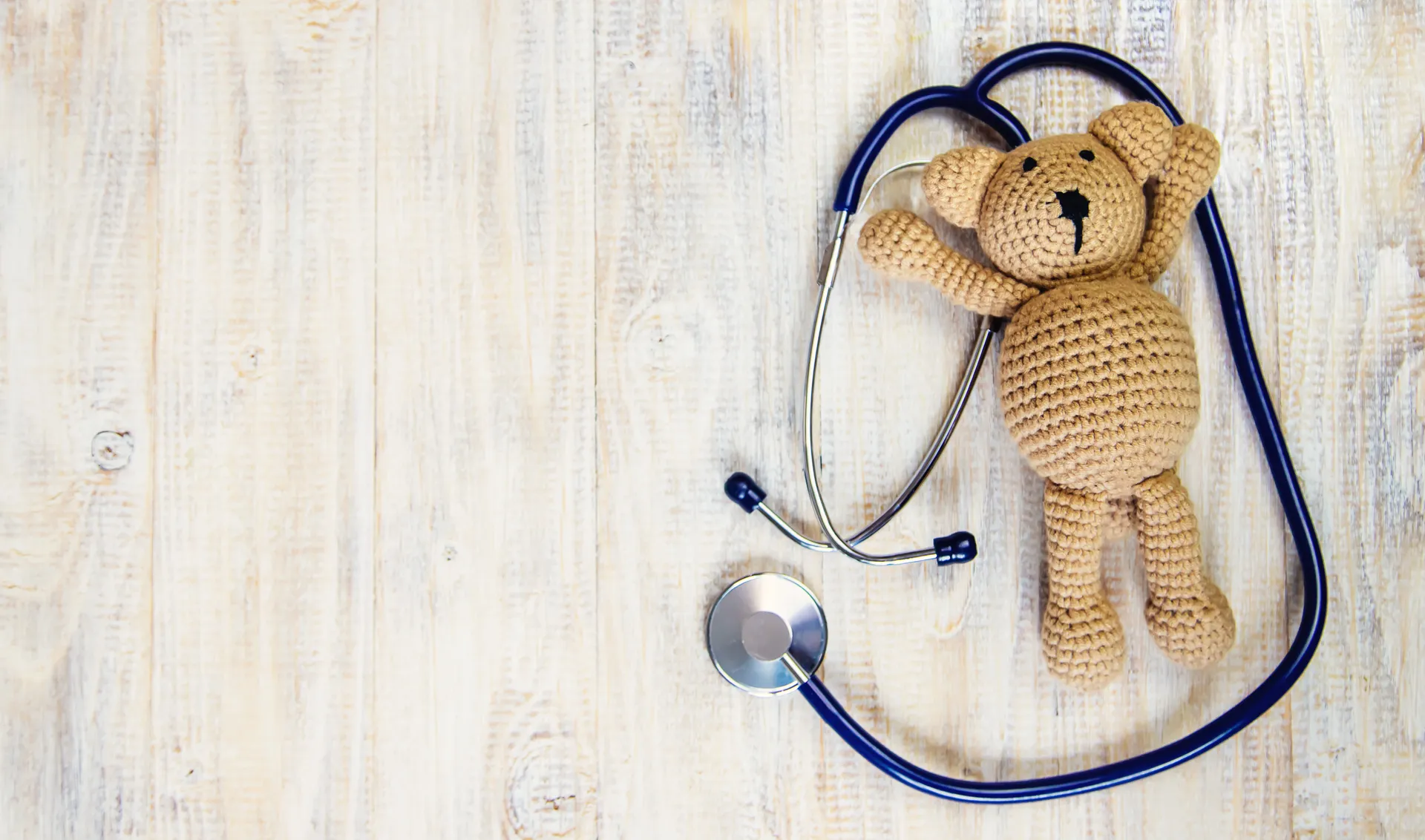 Caring pediatrician with child